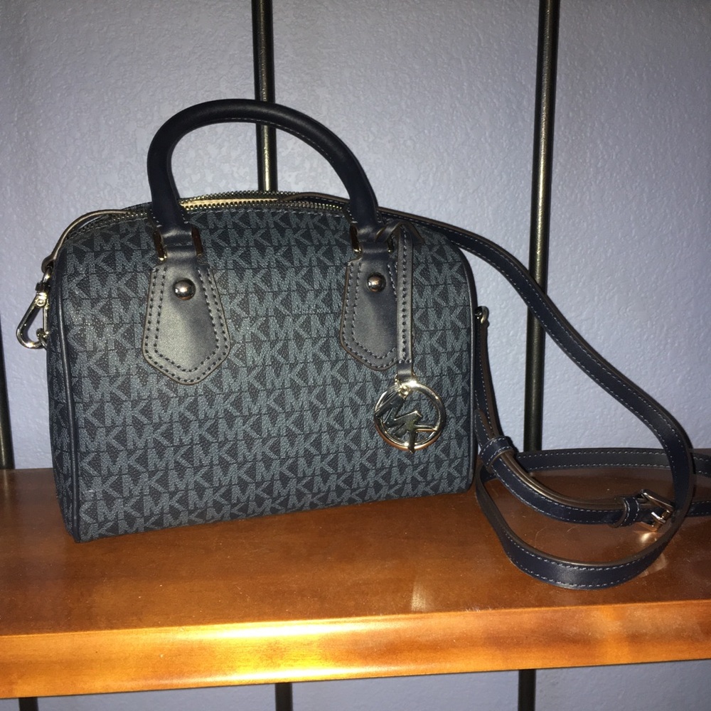 Blue Michael Kors purse, long strap included.